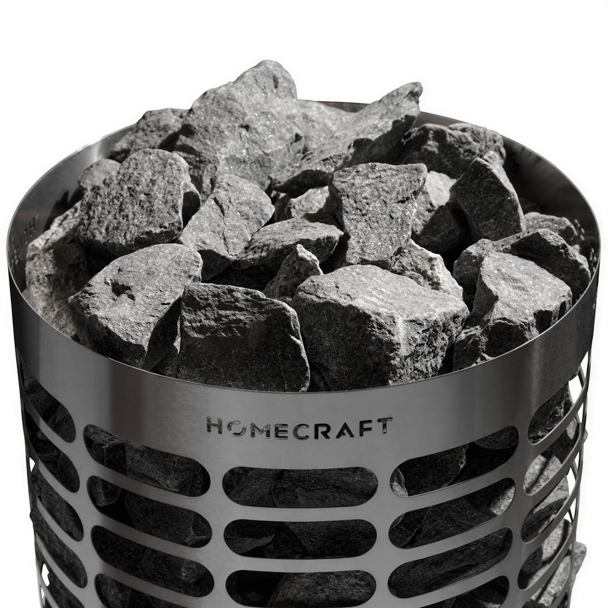 Grey stones piled inside a cylindrical metal Homecraft sauna heater with oval cutouts.