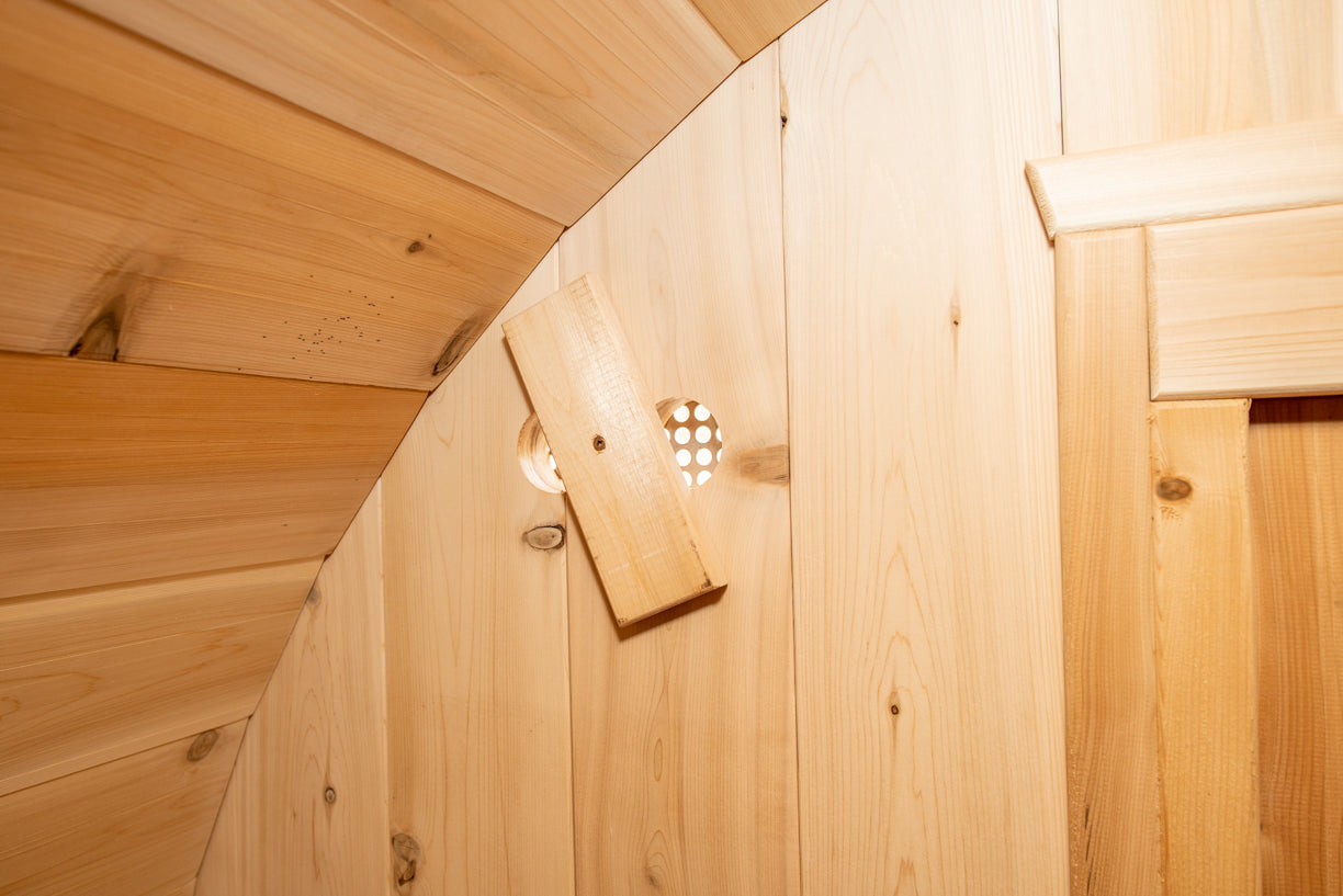 Inside of barrel sauna showing fresh air vent