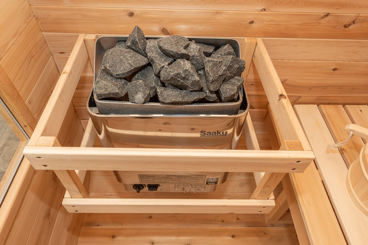 Electric sauna rock heater in a wooden sauna