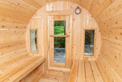 Wooden sauna with benches and a glass door