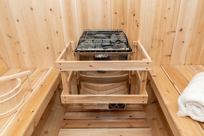 Wooden sauna with a Harvia stove inside