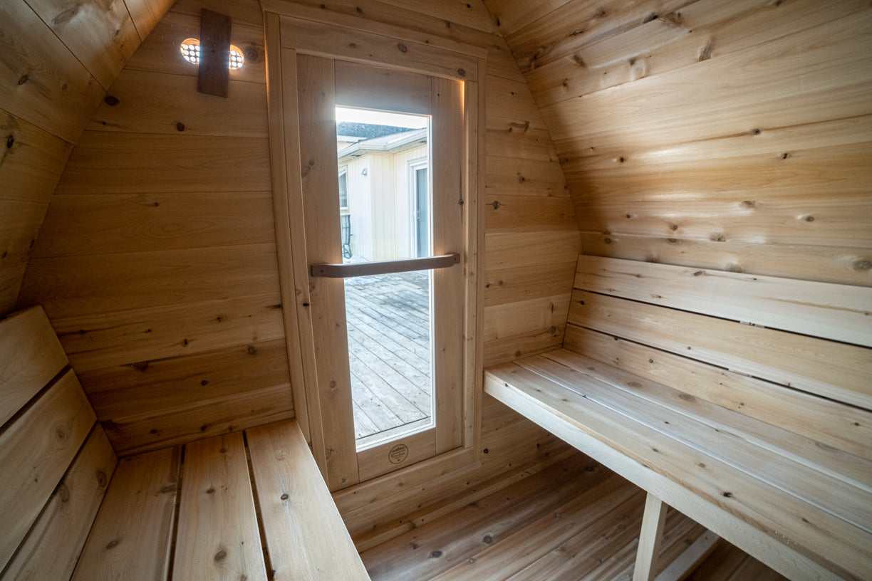 Wooden sauna with benches and a window