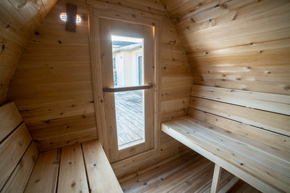 Wooden sauna with benches and a window
