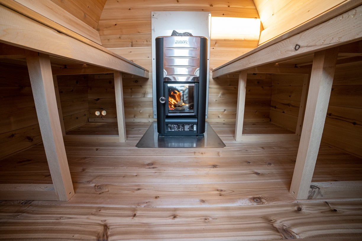 Wooden interior with a stove in the center