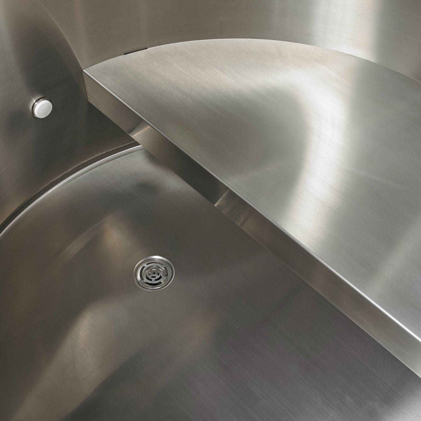 Close-up of the interior of the Dynamic Cold Therapy DCT Barrel - 304 Stainless Steel with Pacific Cedar Exterior (DCT-B-042-SSPC-34) showing the stainless steel construction, seat and drain. 