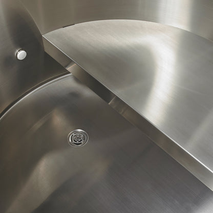 Close-up of the interior of the Dynamic Cold Therapy DCT Barrel - 304 Stainless Steel with Pacific Cedar Exterior (DCT-B-042-SSPC-34) showing the stainless steel construction, seat and drain. 