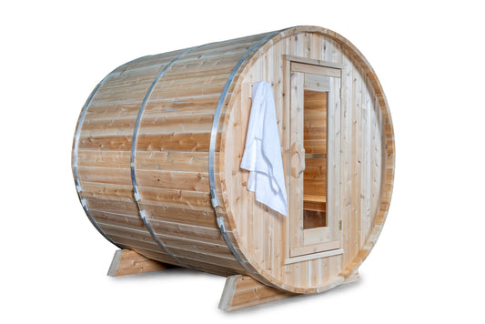 Wooden barrel sauna with a towel hanging on the door on a white background