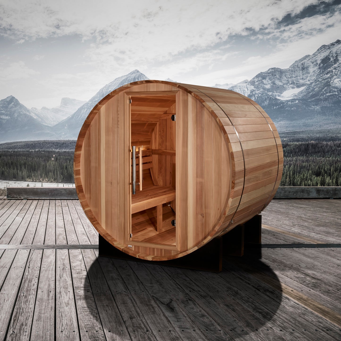 Front of Golden Designs "St. Moritz" 2 Person Barrel Traditional Sauna pictured on a deck with rugged mountains in the background