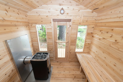 Wooden sauna interior with bench, door, and window