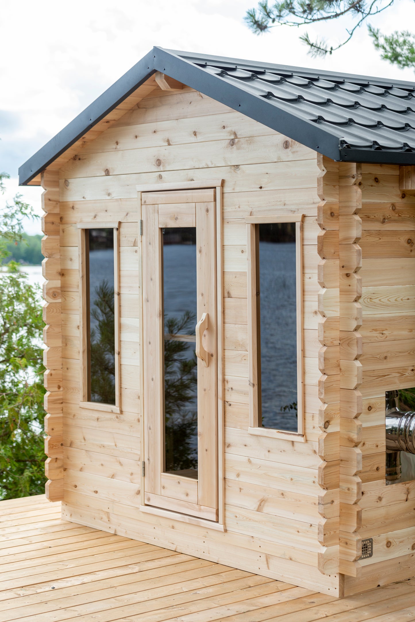 Wooden cabin with a view of water and trees
