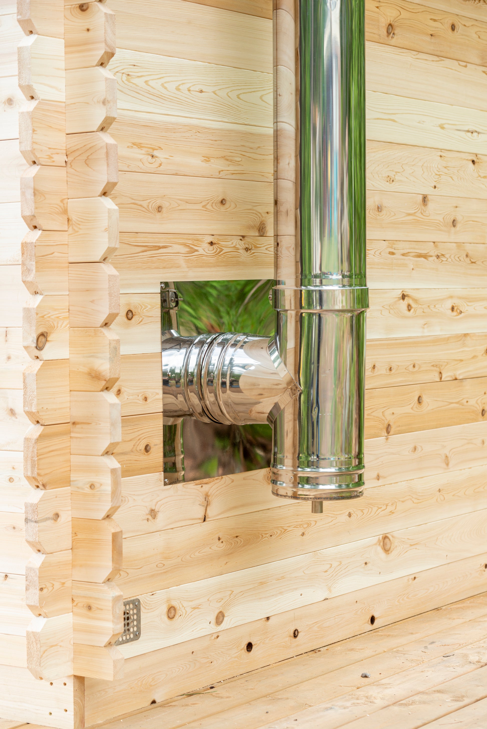 Metal ductwork attached to a wooden wall