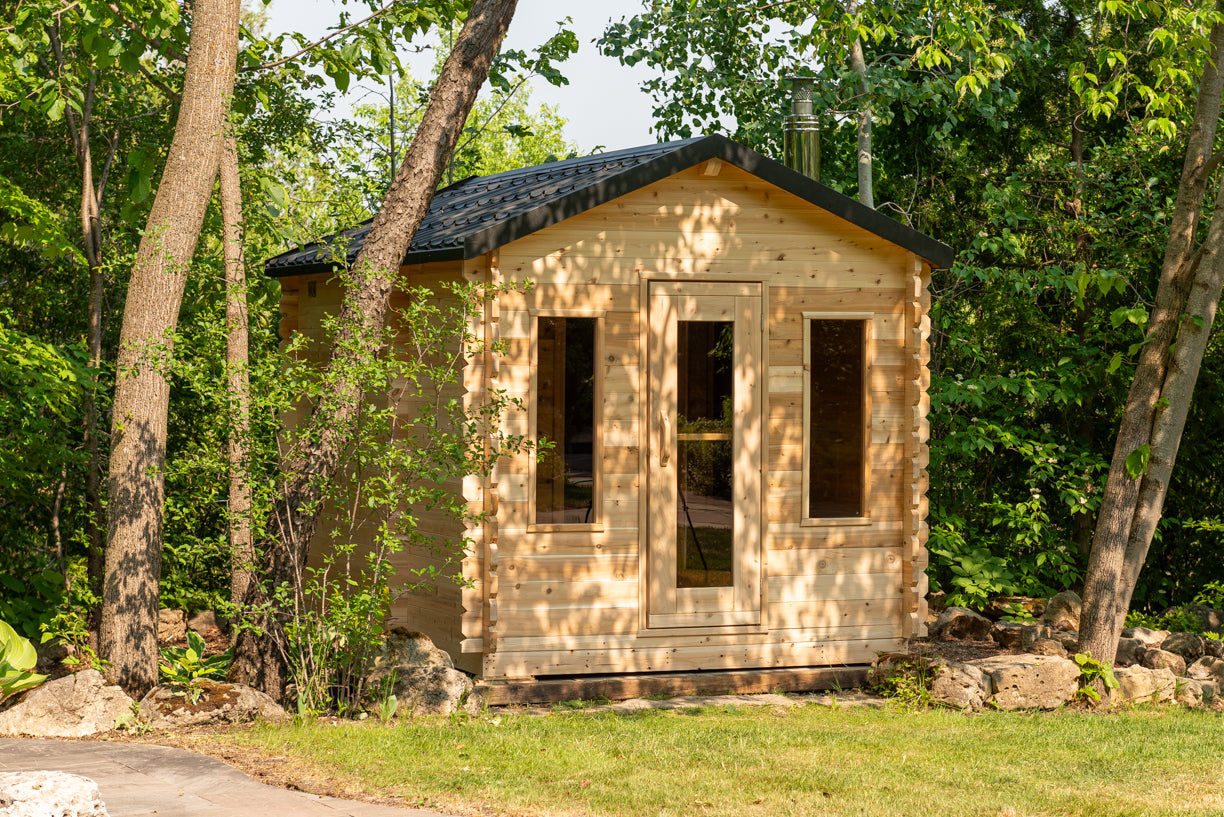 Small wooden cabin in a forest setting