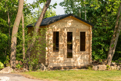 Small wooden cabin in a forest setting