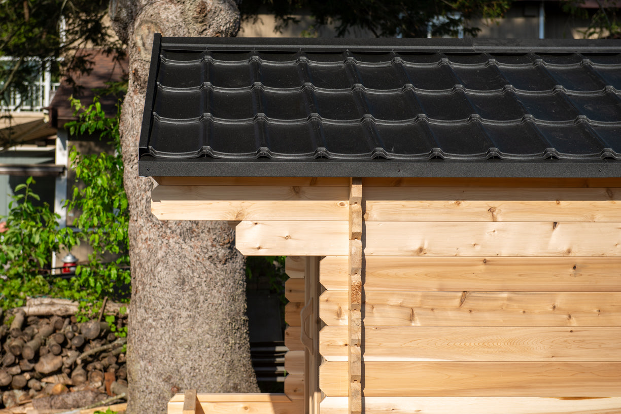 Wooden structure with a black tiled roof in an outdoor setting