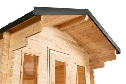 Wooden cabin with a black roof on a white background