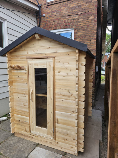 Wooden shed with a small window on a residential street